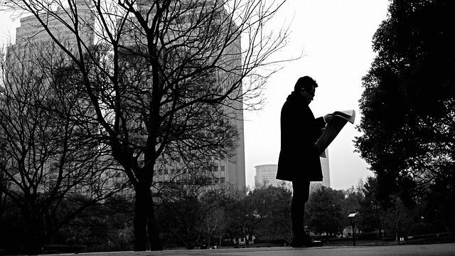 Man in the park with a newspaper